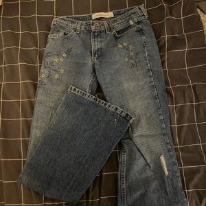 Women's Lowrise Flared Blue Jeans with Floral Print